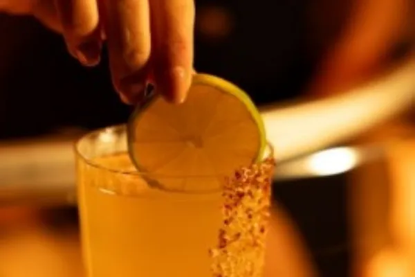 Tamarind Mezcalito cocktail with lime and Tajin at OBVIO NYC
